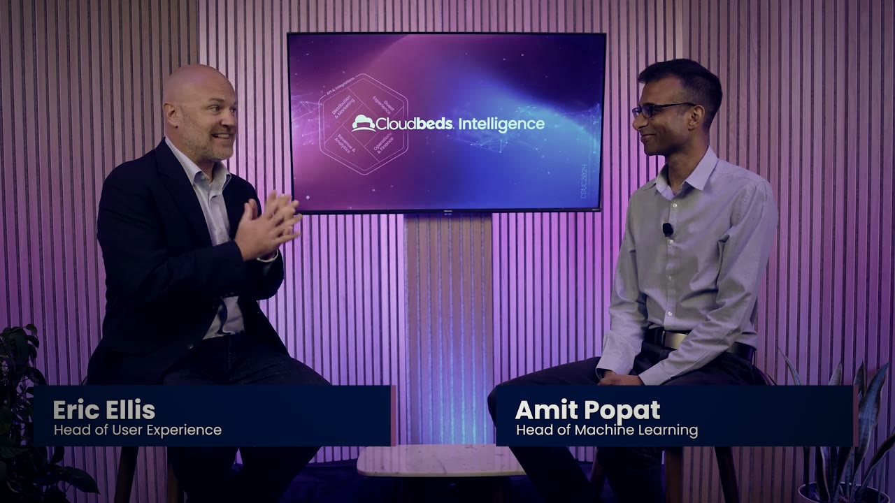 Eric Ellis in conversation on stage at Cloudbeds Passport 2024